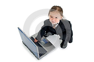 Toddler typing on laptop