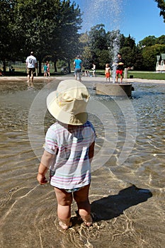 Toddler in wading pool