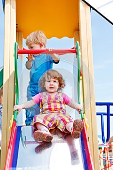 Toddlers on a chute photo