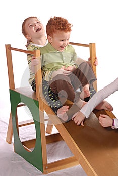 Toddlers on Playground Slide