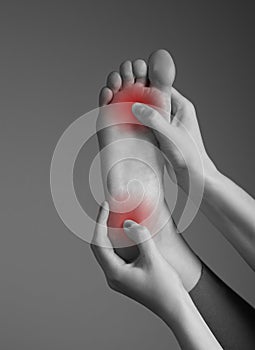Toe and heel pain caused by plantar fasciitis, arthritis, diabetes, tendinitis, spurs, bruise, fracture. Woman hands