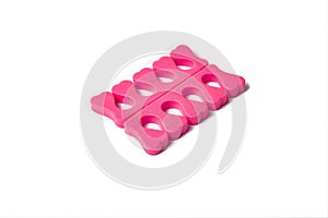 Toe separator isolated on a white background. Pair of toe separator in the form of small hearts. Spongy material