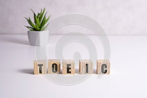 Toeic word on wooden cubes. Toeic concept