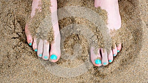 Toes against sand at the beach