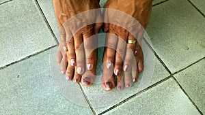 Toes and fingers with bi-color nailpolish photo