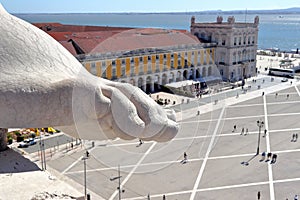 Toes and foot overlooking the PraÃ§a do ComÃ©rcio in Lisbon. photo