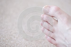 Toes and toenails closeup on barefoot at chiropody photo