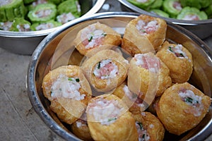 Tofu and bitter gourd filled with chopped pork, a traditional chinese dish.