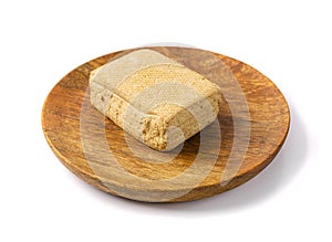 Tofu Cheese Isolated, Smoked Vegan Cheese Slice, Sliced Soya Bean Curd, Soy Protein or TSP photo