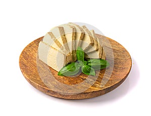 Tofu Cheese Isolated, Smoked Vegan Cheese Slice, Sliced Soya Bean Curd, Soy Protein or TSP photo