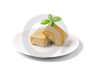 Tofu Cheese Isolated, Smoked Vegan Cheese Slice, Sliced Soya Bean Curd, Soy Protein or TSP photo