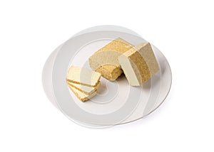 Tofu Cheese Isolated, Smoked Vegan Cheese Slice, Sliced Soya Bean Curd, Soy Protein or TSP photo