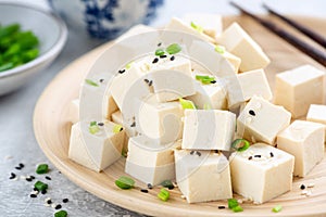 Tofu cubes on bamboo plate