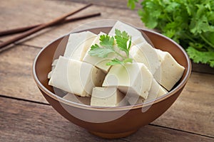 Tofu cubes in bowl and parsley