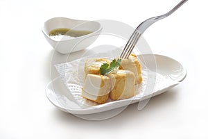 Tofu fish in white plate on white background