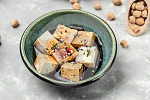 tofu marinated in bowl. traditional chinese dish. Food recipe background. Close up