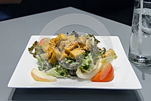 Tofu salad on a white plate