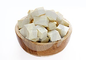 Tofu in a wooden bowl isolated