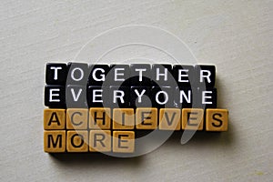 Together Everyone Achieves More TEAM on wooden blocks. Business and inspiration concept photo