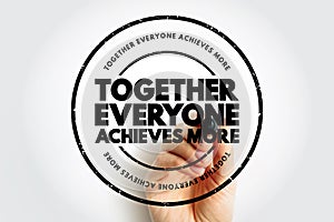 Together Everyone Achieves More text stamp, concept background