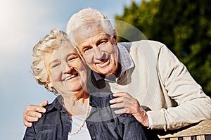 Together forever in love. a happy senior couple relaxing together outdoors.