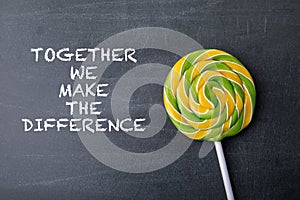 Together we make the difference. Text on a dark chalkboard background