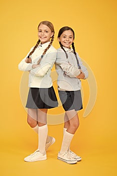 Together since school. education. back to school. kid fashion. Friendship and sisterhood. happy girls in school uniform
