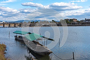 Togetsu-kyo bridge over katsuragawa river with colourful forest mountain background in Arashiyama district.