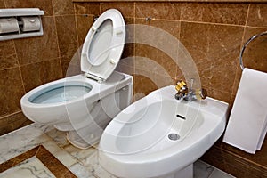 Toilet and bidet in hotel bathroom