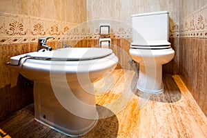 Toilet and bidet in the modern bathroom of hotel