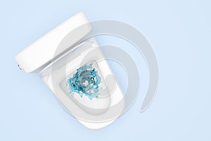 Toilet bowl with vortex, twister water splash isolated on blue background. powerful suction for thorough cleaning concept, 3d
