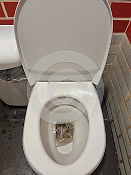 toilet clogging with napkins and paper. clogging in the plumbing.