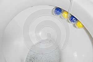 Toilet close-up. White ceramic toilet bowl with cleaning agent