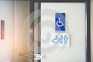 Toilet for disabled people sign on  opened door