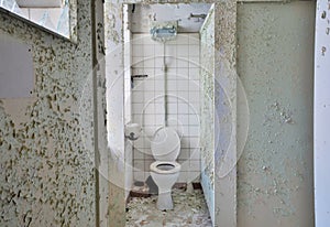 Toilet in a disused factory photo