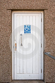 Toilet Door with Disabled Sign