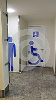 toilet doors in a public place: men\'s toilet and toilet for the disabled