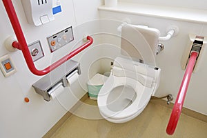 Toilet and handrail for disabled people