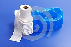 Toilet paper, diapers and blue potty