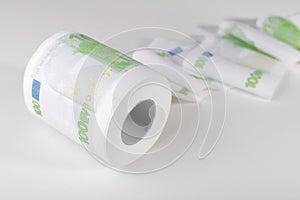 Toilet paper from 100 euro banknotes on whithe background