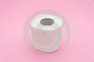 Toilet paper isolated on pink background
