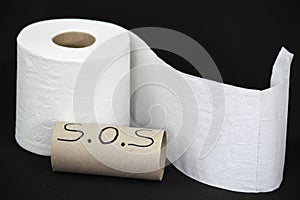 Toilet paper roll on black background photo