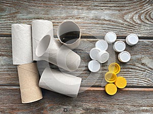 Toilet paper rolls and plastic lids, ready for children`s DIY