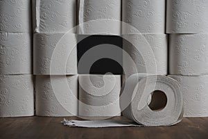 Toilet paper wall with many rolls. before a lonely roll. Soft hygienic paper. Background