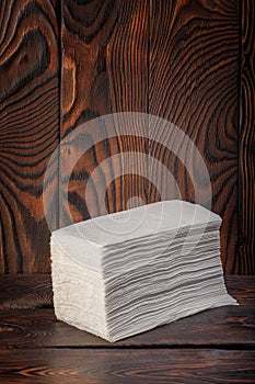 Toilet paper on wooden background