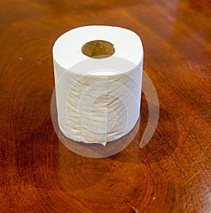 Toilet paper on a wooden table