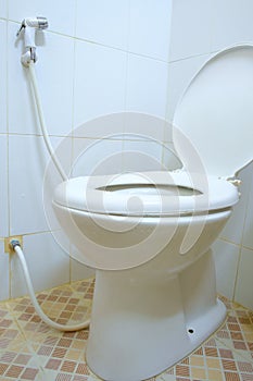 Toilet room corner with open seat cover