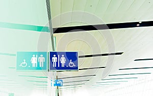 Toilet sign for Male, Female and Handicap with reflection