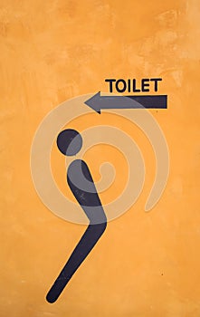 Toilet sign on the orange color background