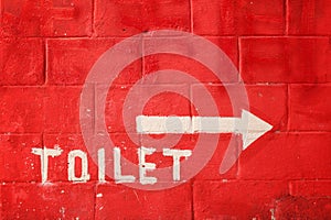 Toilet sign on vintage wall